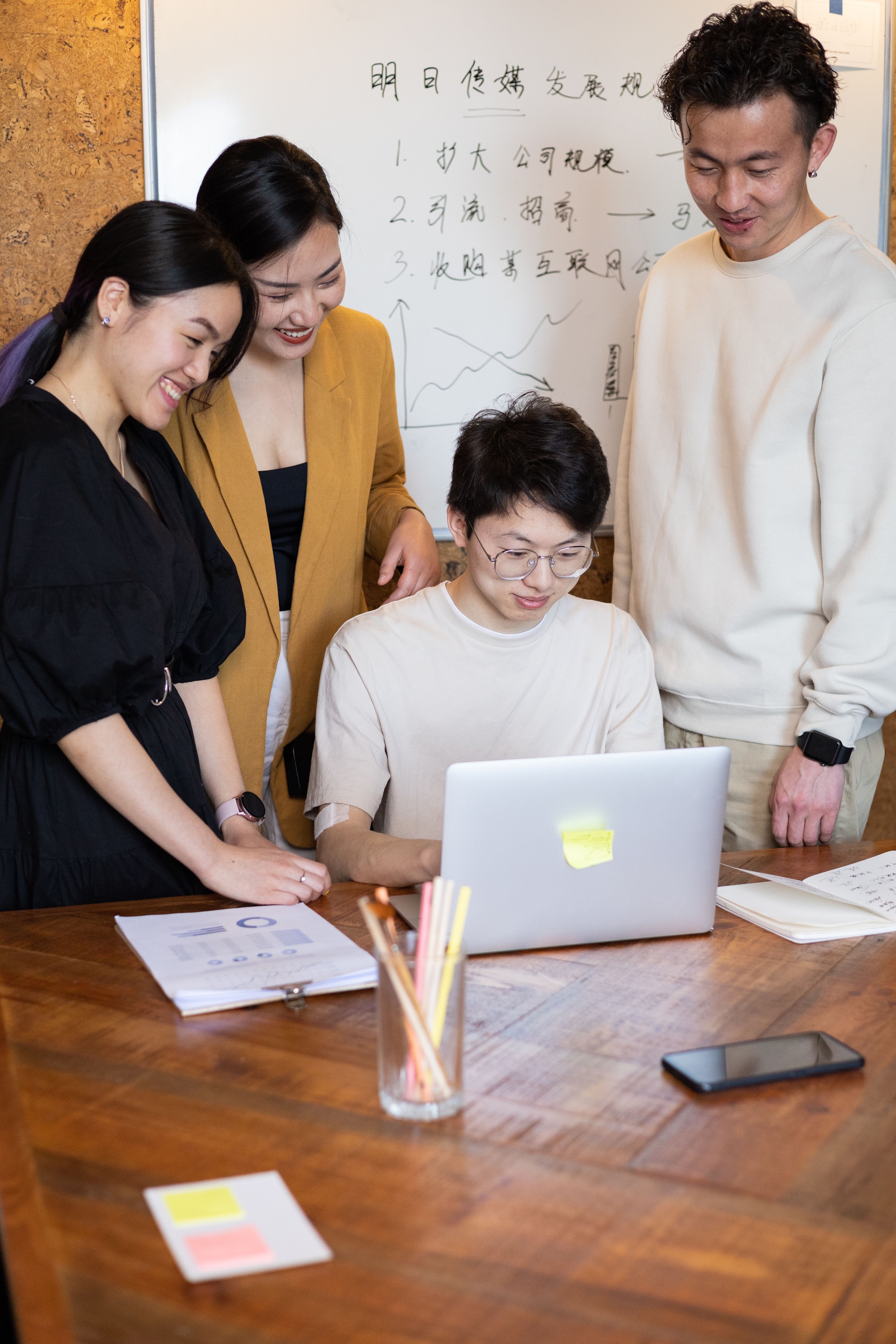 people collaborating around a desk